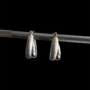 Pierced silver hoop earrings